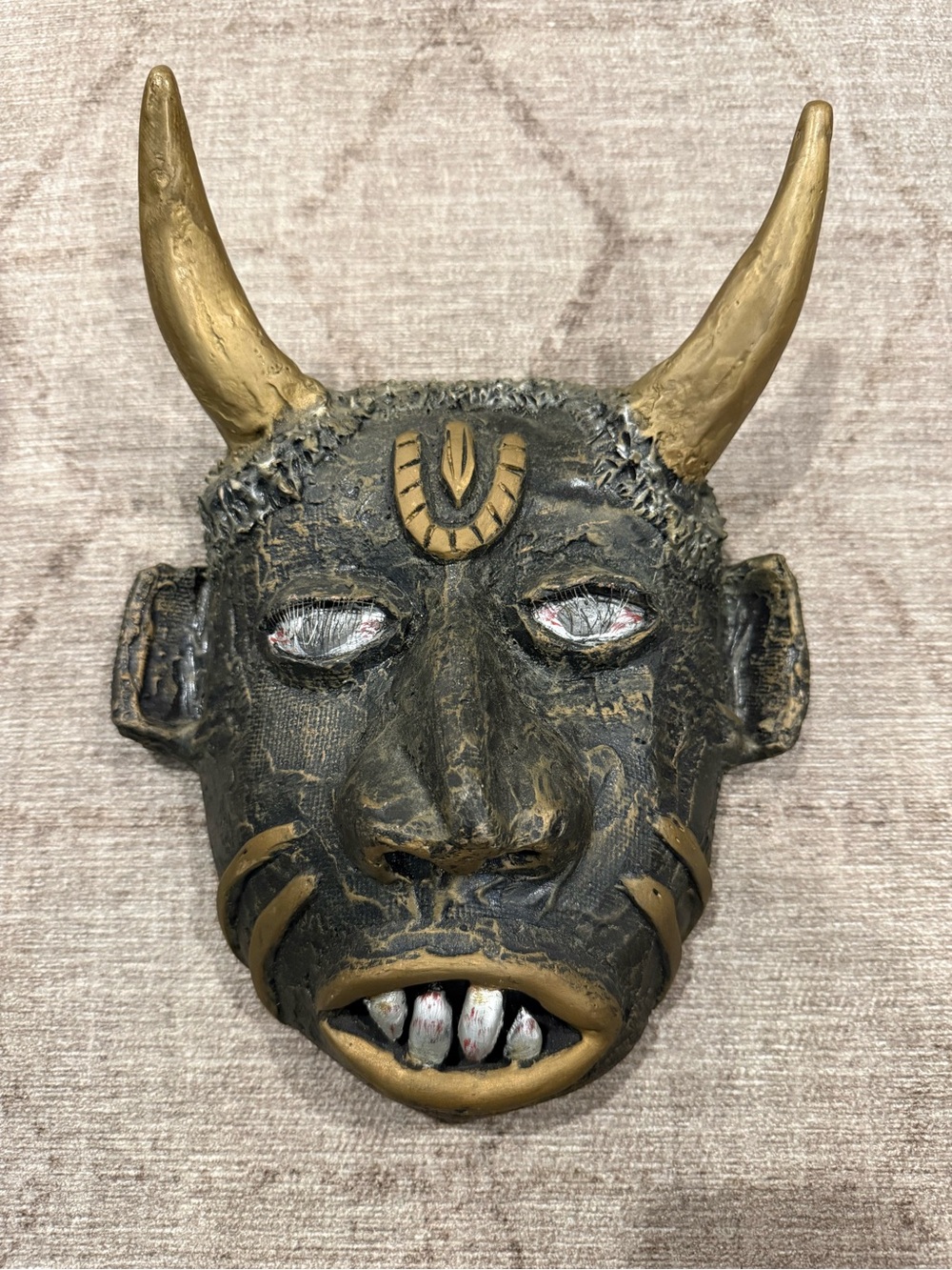 Handcrafted Black and Gold Horned Wall Mask from Barbados